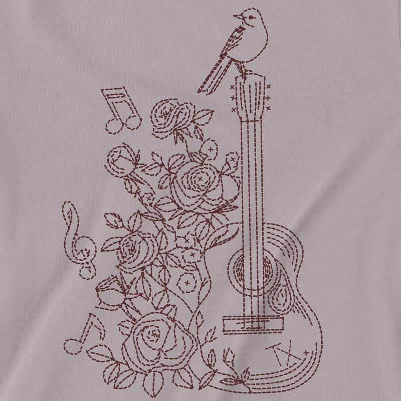 Embroidered design of a guitar, roses, and a bird on a fabric background