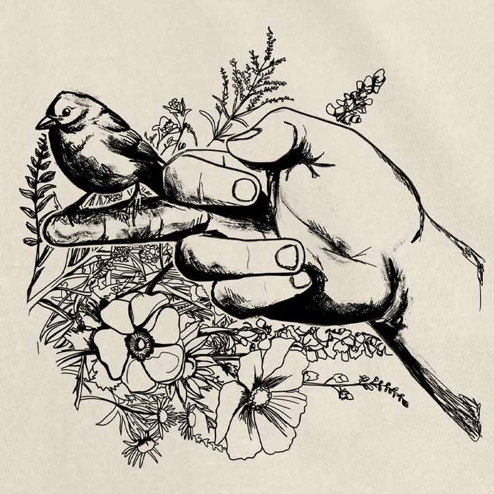 Close-up of bird sitting on middle finger surrounded by pink flowers – cheeky and ironic t-shirt art