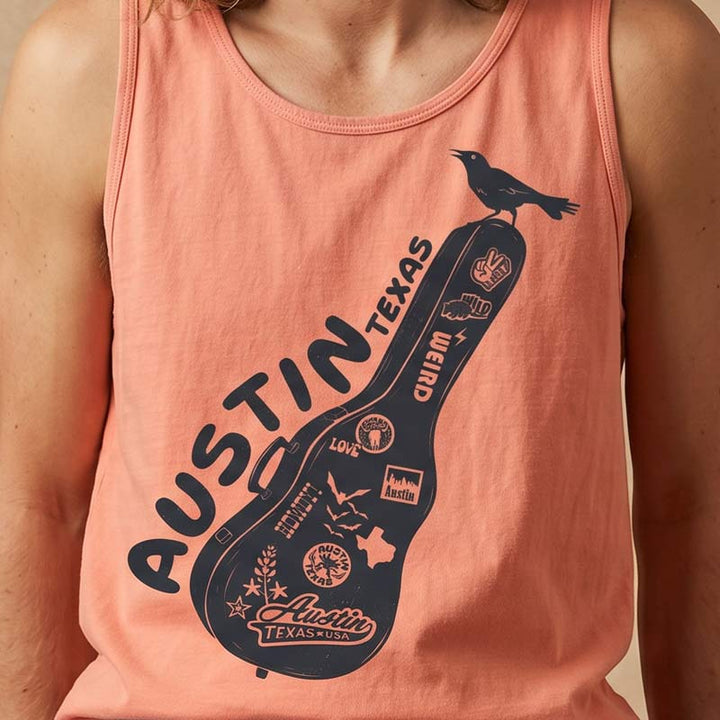 Close up of Carry-On Austin graphic tank top printed on a Comfort Colors 9360 heavyweight tank in Terracotta featuring Austin-inspired guitar case artwork and music-themed design.