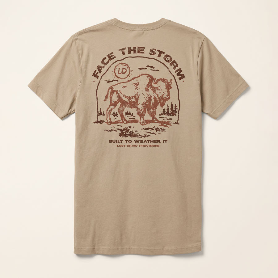Back of the Tan Face the Storm Tee featuring a distressed vintage buffalo illustration and Built to Weather It lettering.