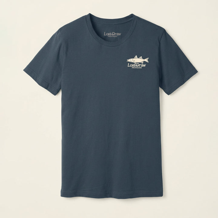 Front of the On the Water Jersey Tee in Vintage Navy with a small cream Lost Draw Provisions fish logo on the left chest.