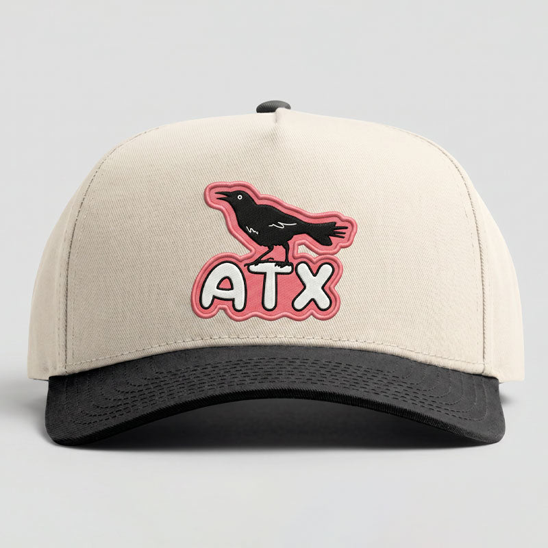 ATX Perch five-panel Austin hat with cream crown and black brim featuring UV printed grackle patch