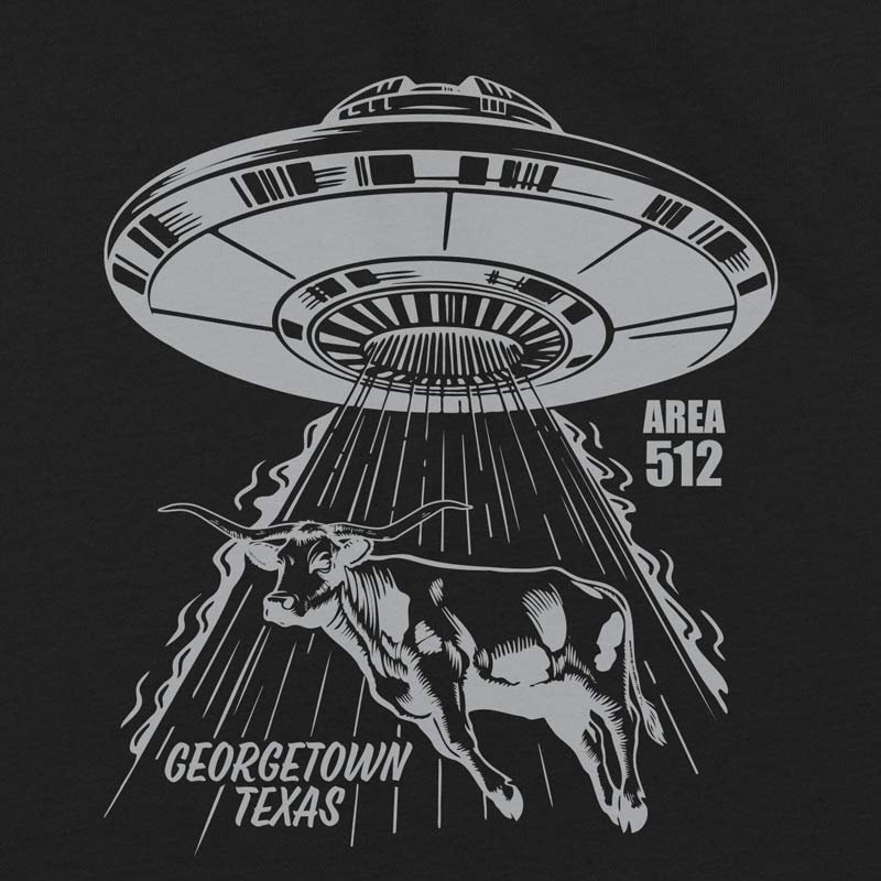 Close-up of metallic silver screen print on Georgetown Area 512 youth t-shirt showing UFO and Texas longhorn graphic detail.