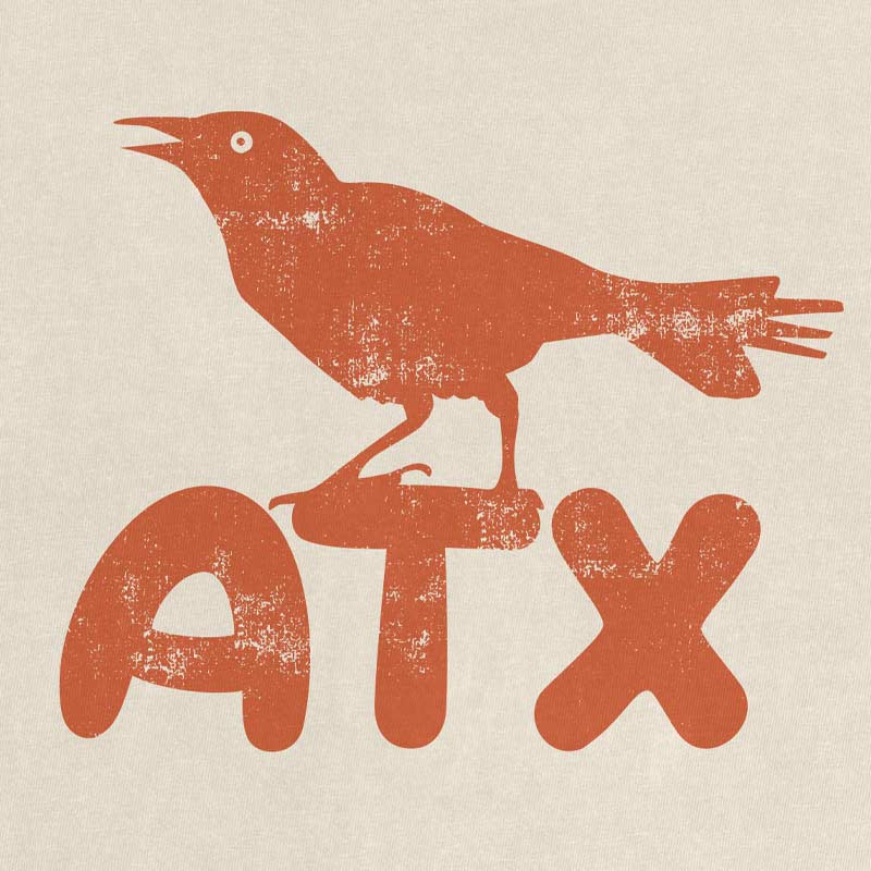 Close-up of ATX lettering with bird perched on top