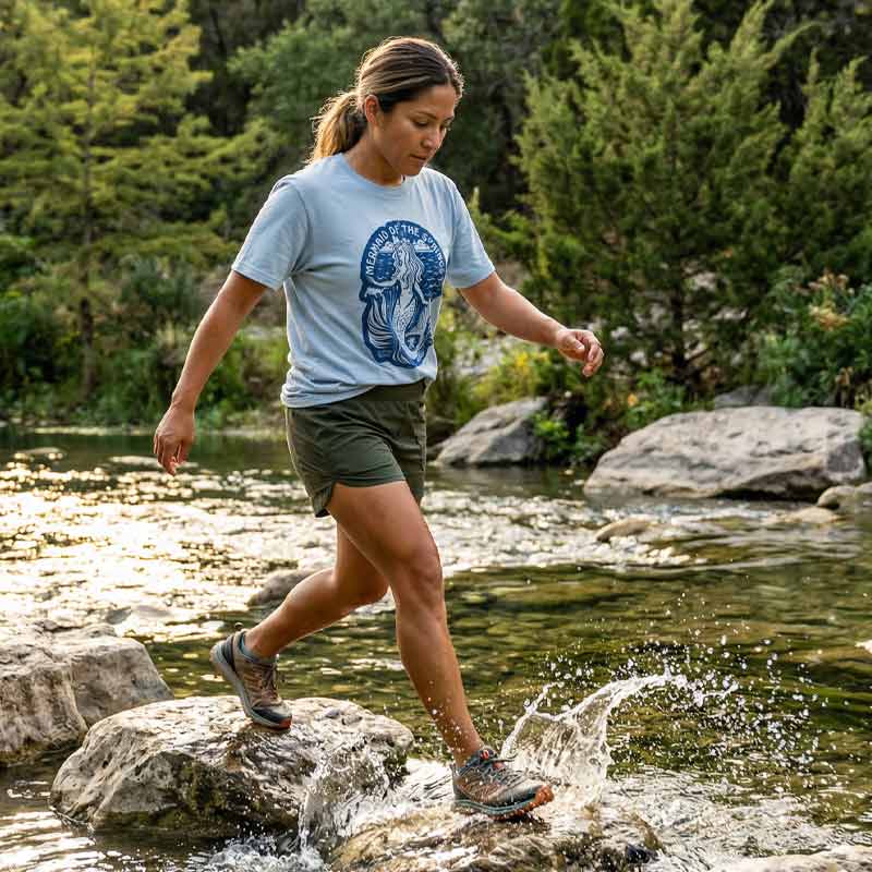 Lifestyle image of woman wearing relaxed fit Austin springs graphic tee