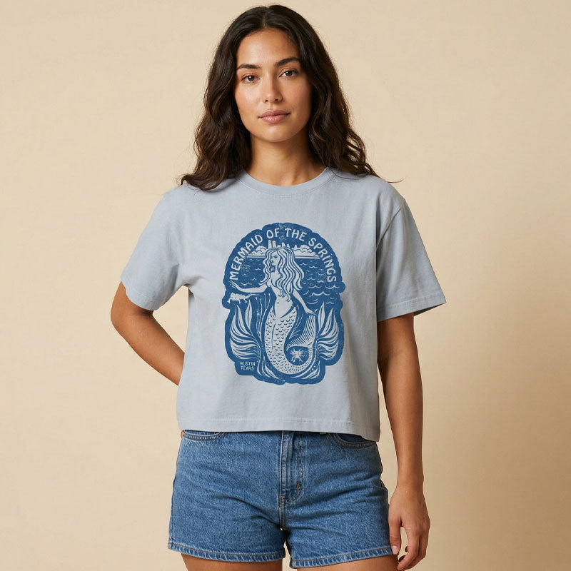 Woman wearing Barton Springs Mermaid women’s boxy t-shirt with mermaid graphic
