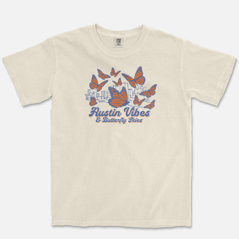 Austin Butterfly Skies ivory t-shirt with monarch butterflies and skyline graphic flat lay