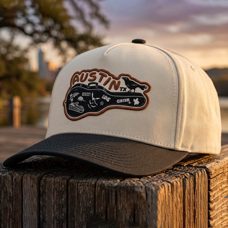 Detailed close-up of UV printed Carry-On Austin patch on structured five-panel cotton twill hat