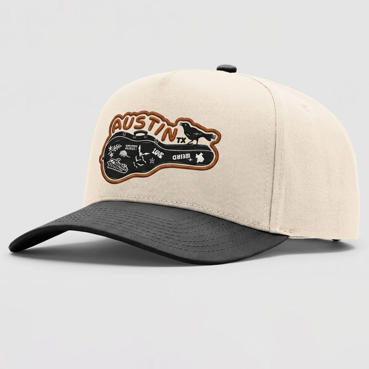 Side angle of cream and black Richardson five-panel cap with Carry-On Austin UV printed patch
