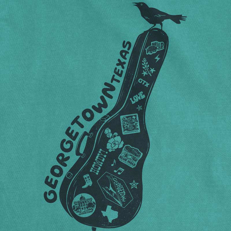 Close up of Carry-On Georgetown Texas T-shirt on seafoam Comfort Colors tee with guitar case graphic and local Georgetown icons
