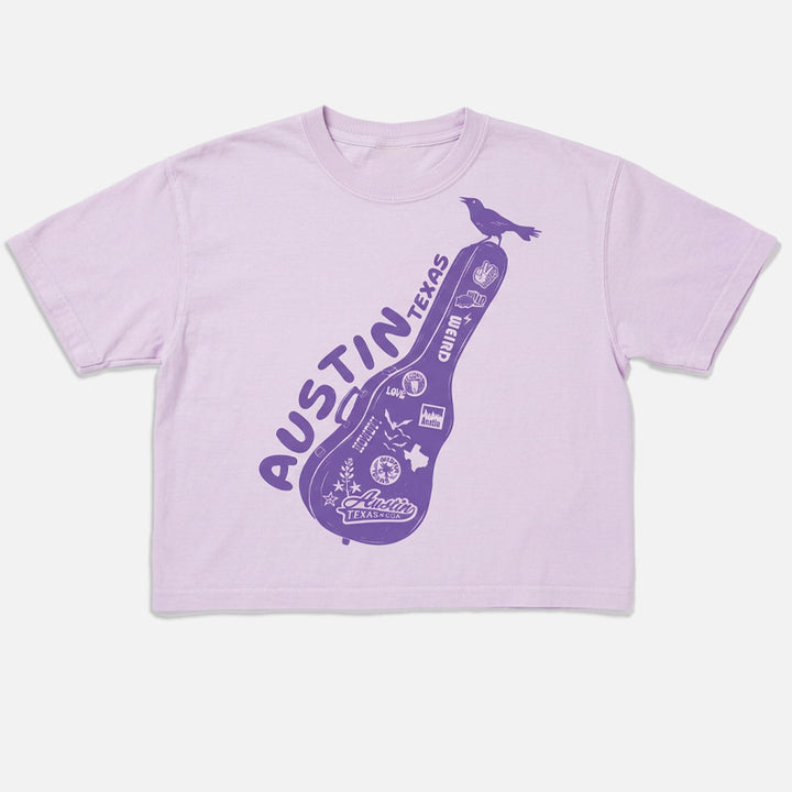 Lavender t-shirt with 'Austin, Texas' graphic on a white background