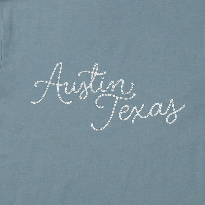 Close-up of Austin Texas chainstitch-style script graphic