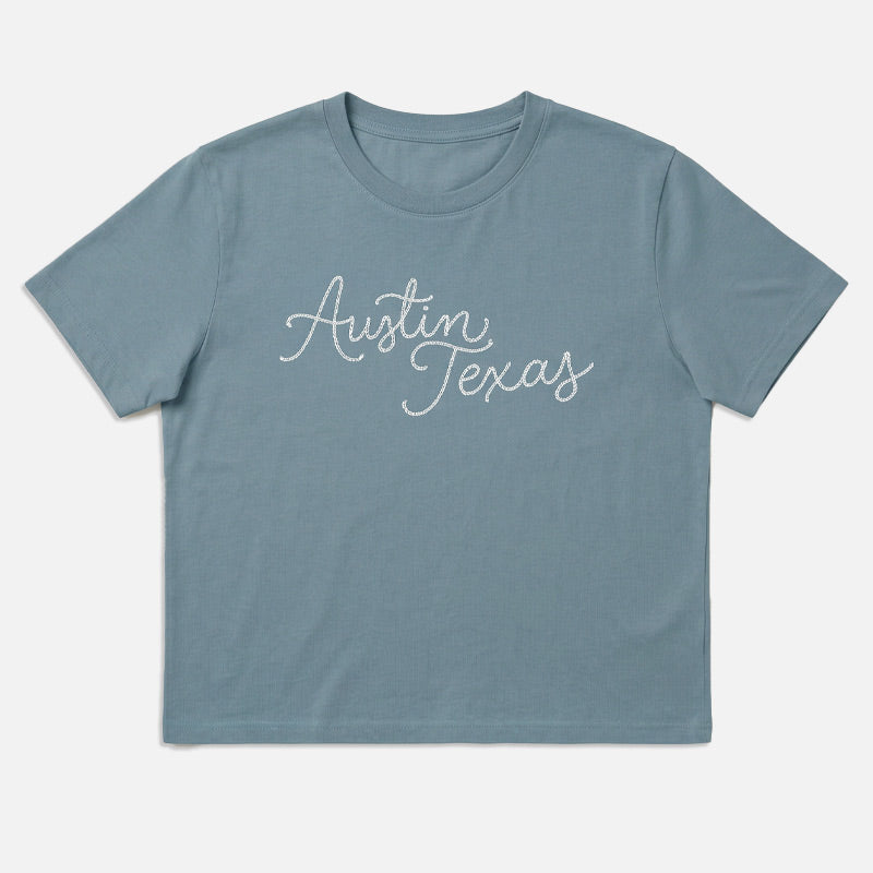 Flat lay front view of Chainstitch Austin women’s heavyweight t-shirt