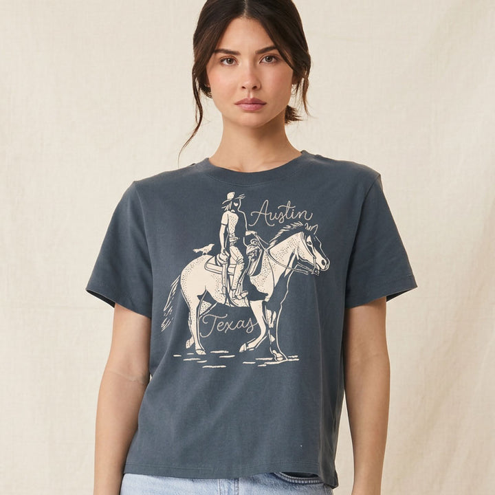 Lifestyle image of woman wearing relaxed fit western graphic tee