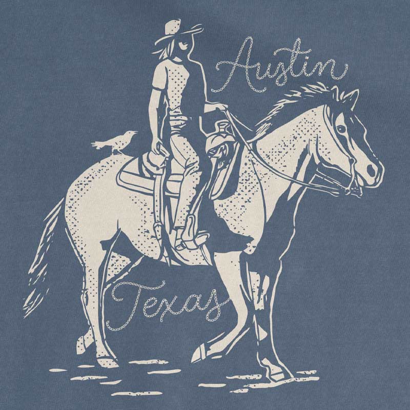 Close-up of Dust and Reins Austin design on heavyweight t-shirt