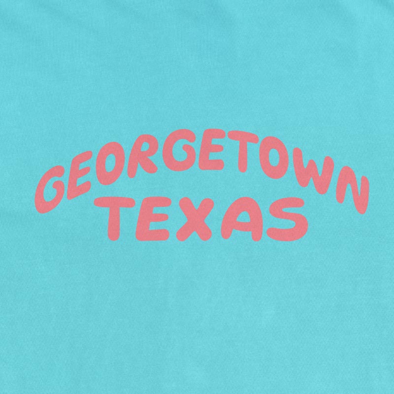 Georgetown Texas pop lettering T-shirt on lagoon Comfort Colors 1717 with coral text graphic
