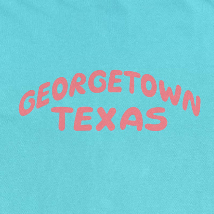 Georgetown Texas pop lettering T-shirt on lagoon Comfort Colors 1717 with coral text graphic
