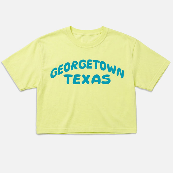 Georgetown Pop graphic tee in Neon Lemon with blue Georgetown Texas lettering flat lay