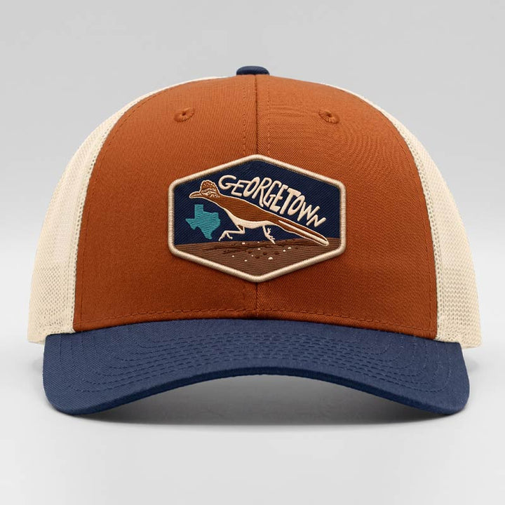 Georgetown Road Runner trucker hat on a Richardson 115 low-profile snapback in dark orange, birch, and patriot blue featuring a UV printed patch designed to look embroidered.