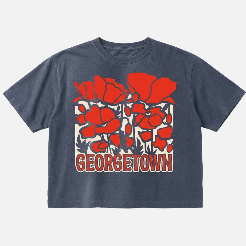 Georgetown Texas women’s boxy t-shirt in garment-dyed navy with bold red poppy graphic and relaxed cropped fit