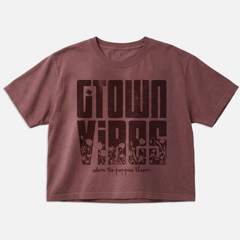 Maroon t-shirt with graphic design and text on a white background