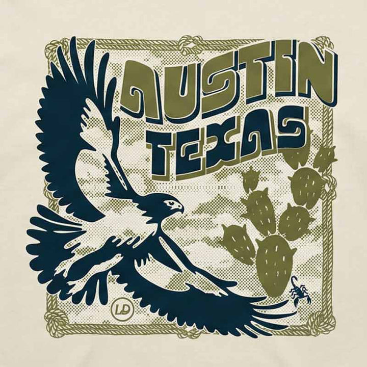 Close-up of Hawk & Thorn graphic featuring hawk and desert cactus design