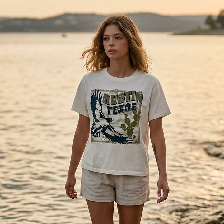 Women’s heavyweight boxy tee with vintage hawk illustration in navy and olive tones by lake travis