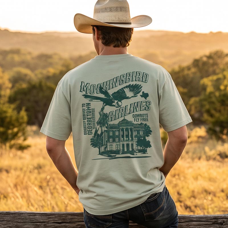 Back view of model wearing Mockingbird Airlines Georgetown Texas oversized T-shirt with large Georgetown screen print