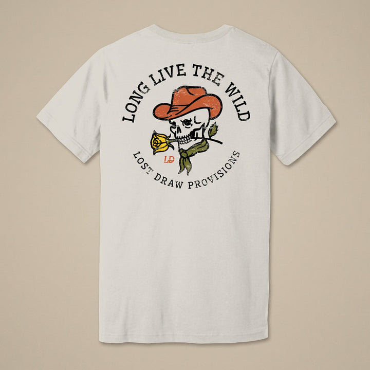 A white short-sleeve t-shirt shown from the back, featuring a graphic print of a skull wearing an orange cowboy hat and holding a yellow rose. The text &