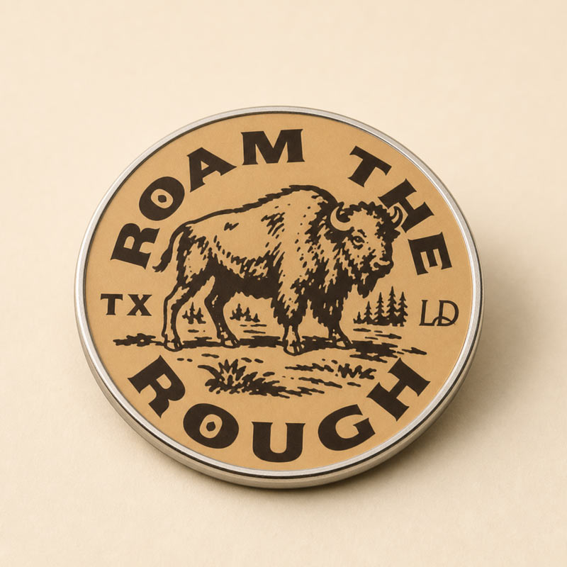 A round metal tin with a kraft-paper style label reading &