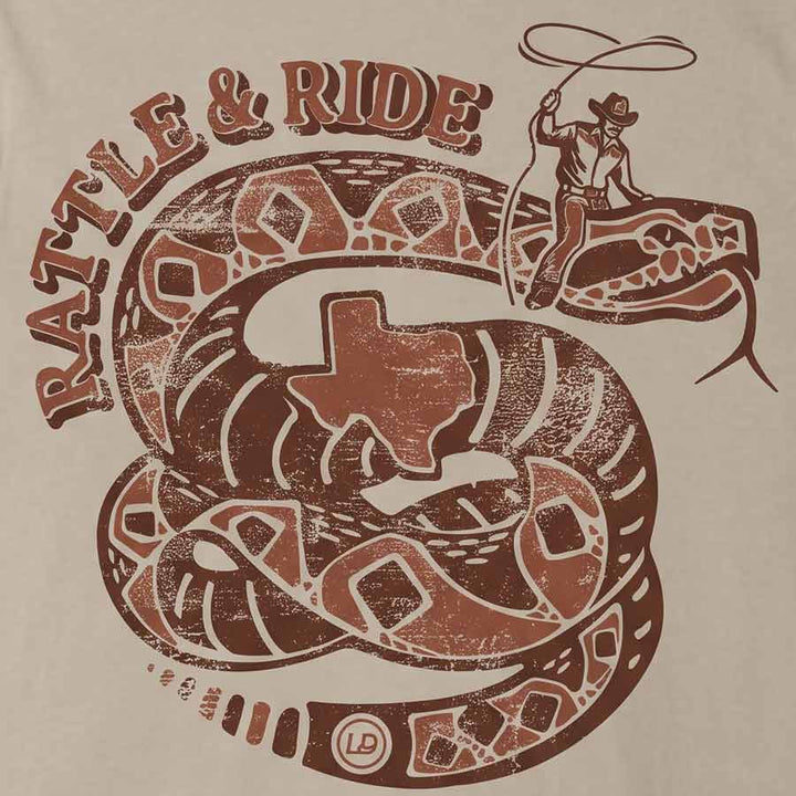 A close-up of a graphic print on a beige fabric, featuring a brown distressed design with the text &