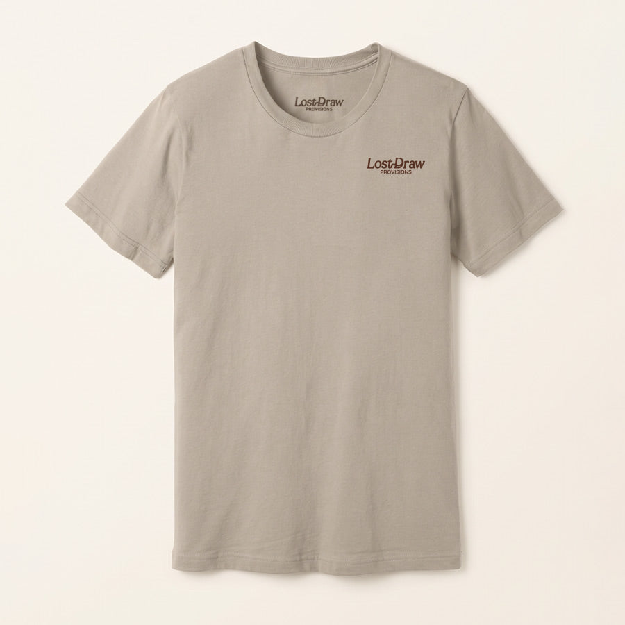 A light gray crewneck t-shirt with a small brown &