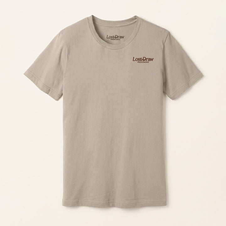A light gray crewneck t-shirt with a small brown &