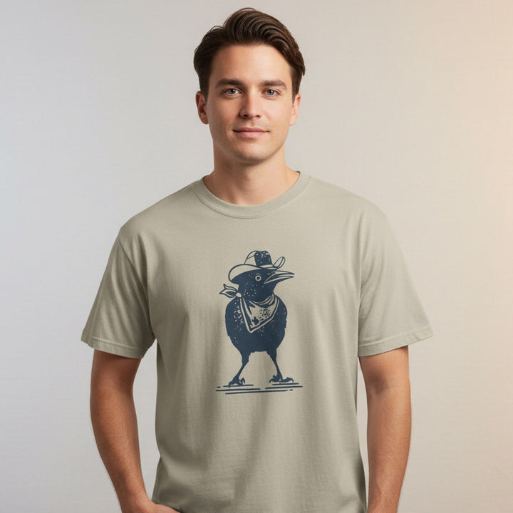 Man wearing a beige t-shirt with a graphic design on a plain background