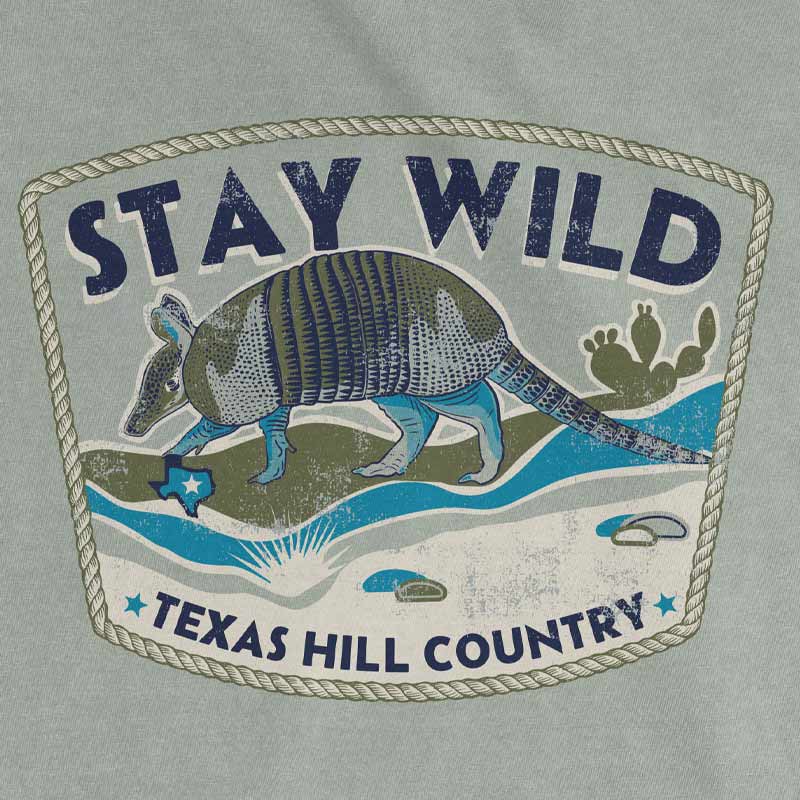 Stay Wild Texas Hill Country armadillo graphic printed on the back of a Comfort Colors 1717 Bay t-shirt