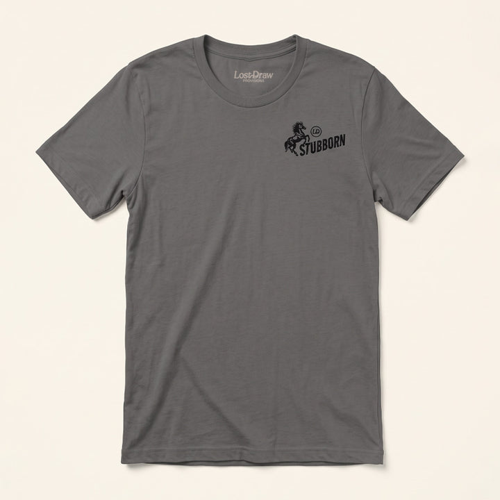 Front of the Too Stubborn Jersey Tee in Asphalt featuring a small black rearing horse and Stubborn graphic on the left chest.