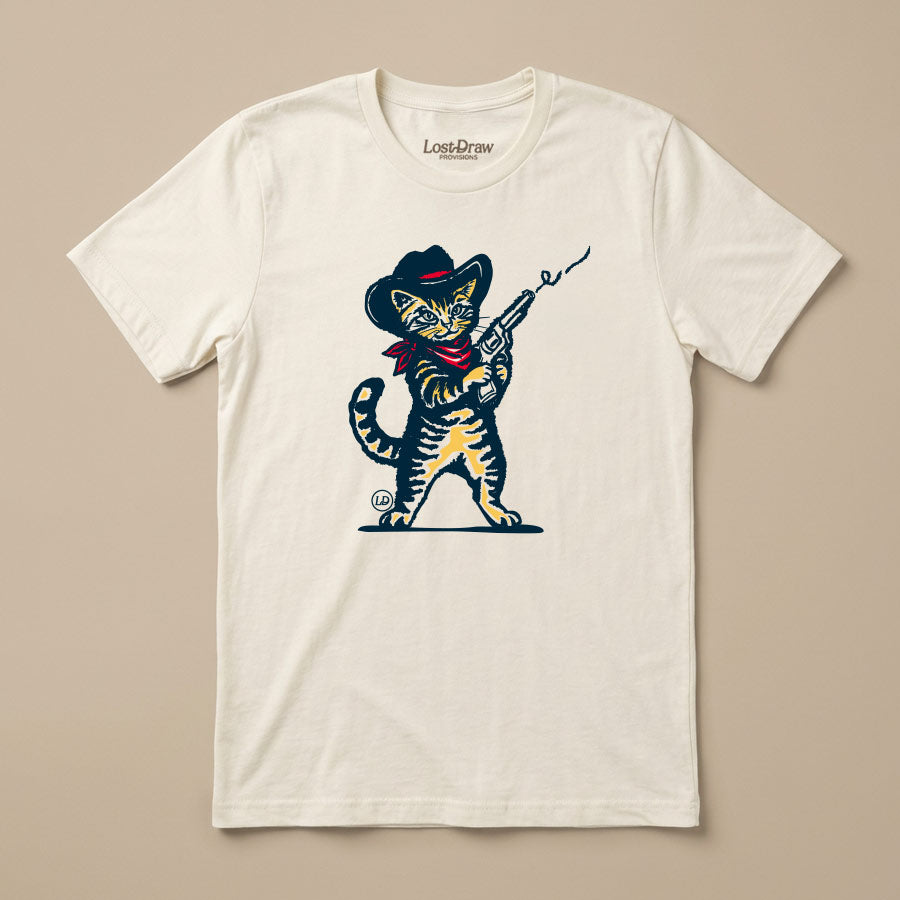 Wilder Than the West cowboy kitten graphic tee on a Bella+Canvas 3001 Vintage White unisex shirt.